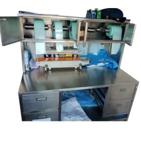 S. S. PACKING, SEALING, AND LABELLING TABLE WITH OVER HEAD CABINET, UNDER SHELF AND DRAWER.